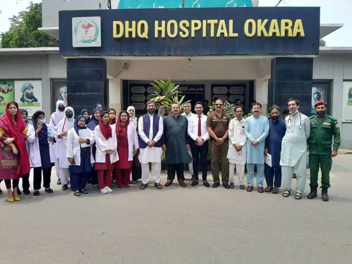 Al-Nisa Welfare Society representatives outside DHQ Hospital Okara during a coordination visit with district health officials
