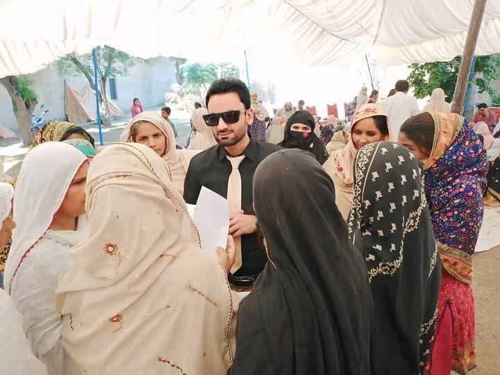 Al-Nisa Welfare Society representative engaging with women during a community activity