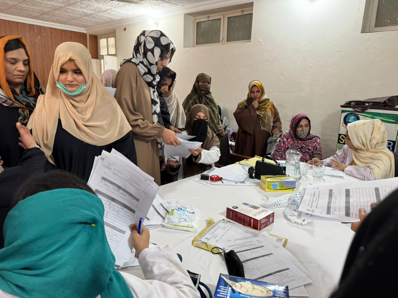 Al-Nisa doctor providing medical care  during a community visit